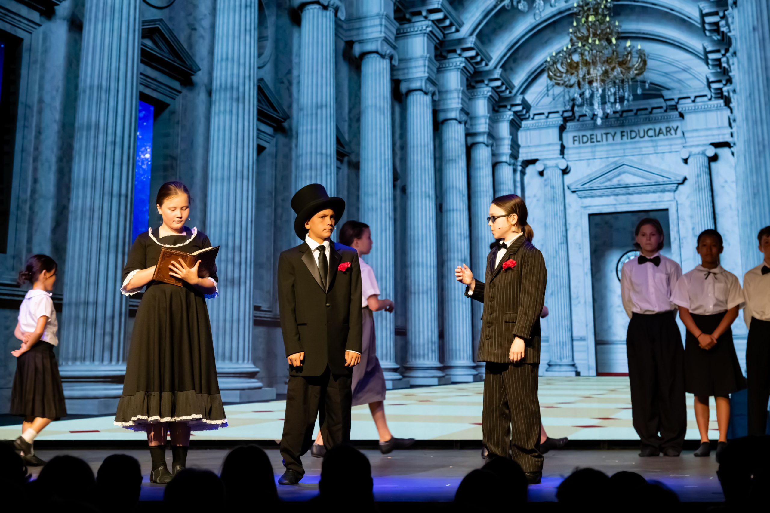 LED screen backdrop in school theater scene with classical columns